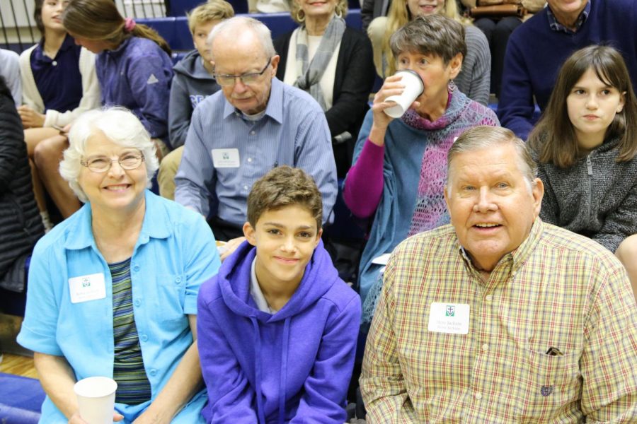Sixth grader Stevie Dean Jackson smiles with his grandparents. Classes were extra crowded during the first two periods because around 150 grandparents came to shadow students.