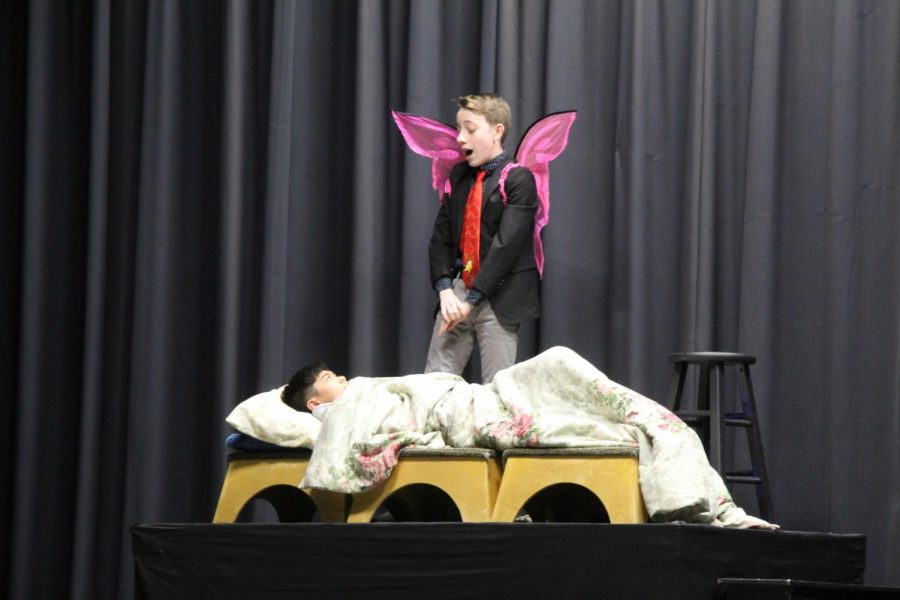 Freshmen Ivan Calderon stands over classmate Ethan Tangpornsin during the ninth grade play. Every year, the freshman drama class performs a play for the whole school