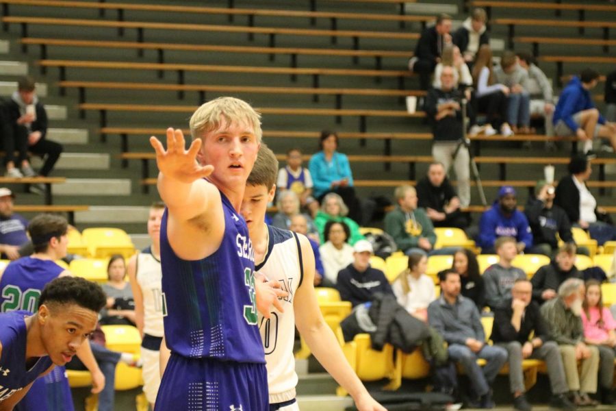  Senior Luke Hornberger guards the basket. Seabury won against Veritas with a final score of 86-38.