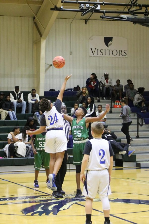 Sixth grader Christien Green takes the tip off against Brookside Charter. Green played for both the A and B teams.