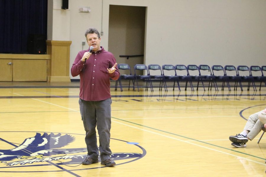 Father Rob Baldwin tells a story during chapel. Baldwin returned to Seabury after his three year absence this year.