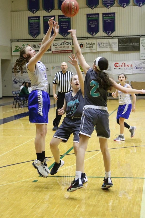 Seventh grader Avery Bird shoots a basket. Bird played aggressive defense and made great plays during all the games.