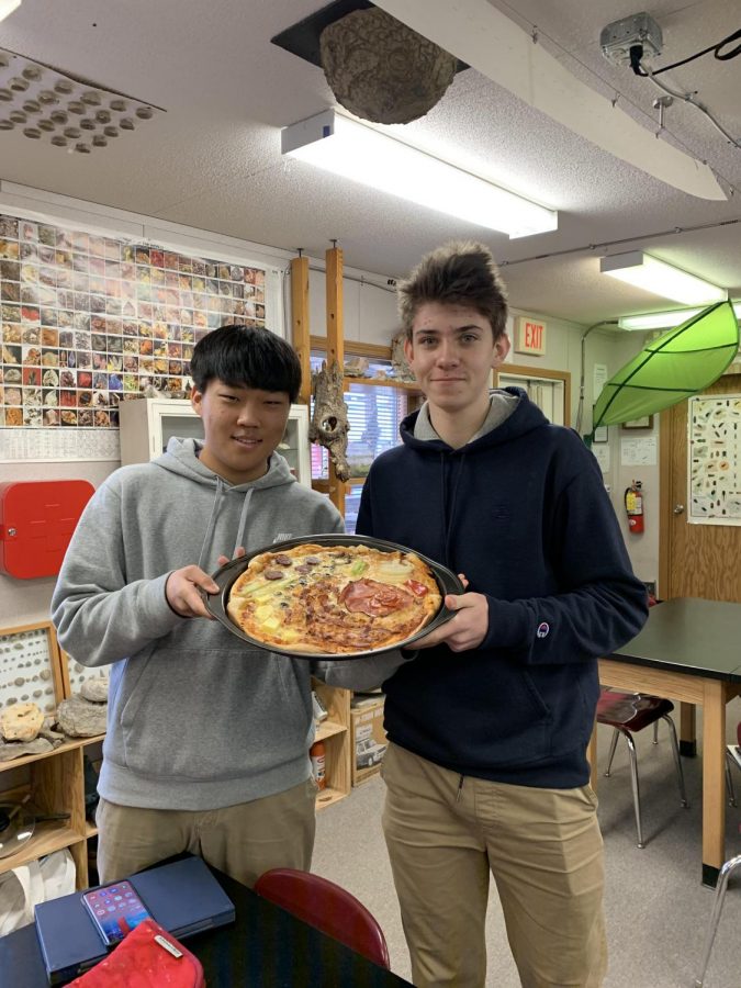 Freshman Tony Jung and Martin Hill show off their edible cell project. The project had to model at least 15 parts of the cell.