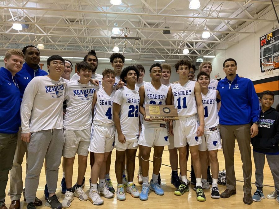 The varsity boys pose for a photo with the substate trophy. The boys dominated substate and junior point guard Zach Bloch scored his 1000th point during the semifinal round against Mission Valley.