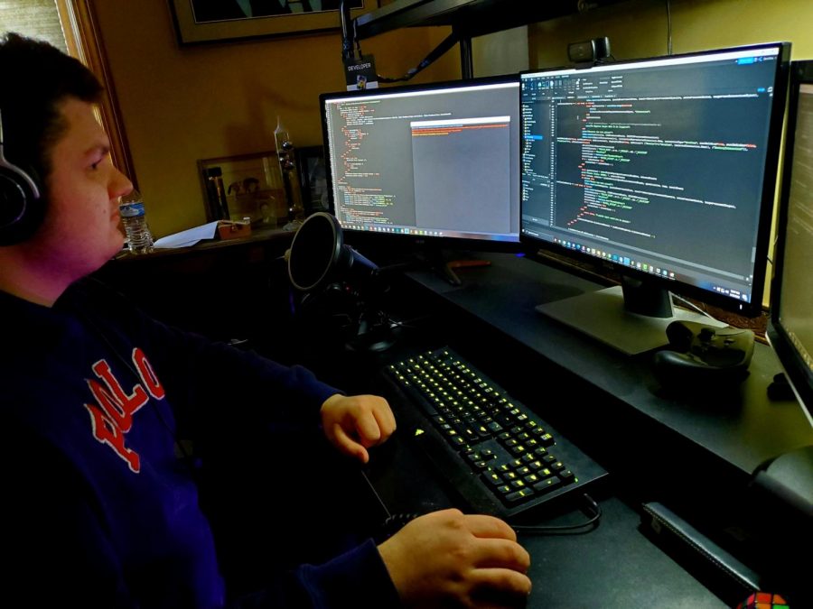 Senior Wil Johnson works on coding Escape Room 2. Johnson spent two years creating the original Escape Room and has spent nine months so far creating its sequel.