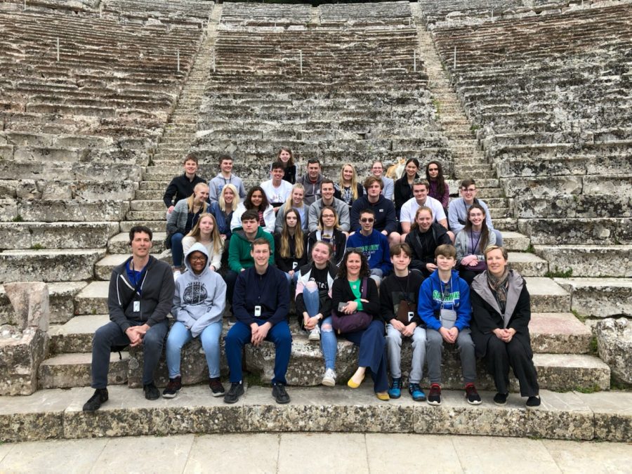 Participants+of+the+Greece+trip+smile+for+a+photo+at+the+Great+Theatre+of+Epidaurus.+The+students+found+a+cat+in+the+theatre+who+turned+out+to+be+particularly+friendly+and+made+an+appearance+in+the+group+photo+above