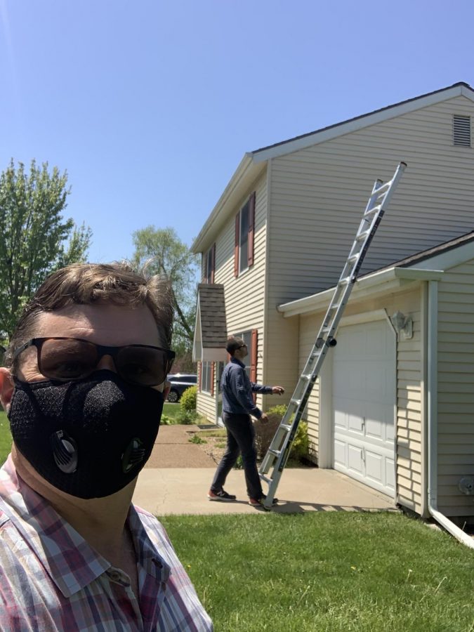 Bryan Hedges takes a selfie with a house inspector. Hedges' real estate business has adapted quickly to the COVID-19 pandemic. 