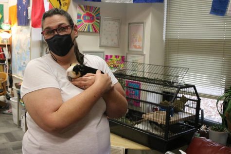 Lady Asher shows off one of the new Guinea Pigs. They are the only pets living inside the school.