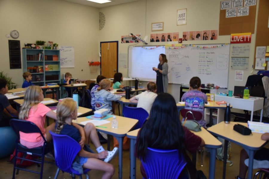 New English teacher Mrs. Amanda Lovett explains quote sandwiches to the sixth grade class.