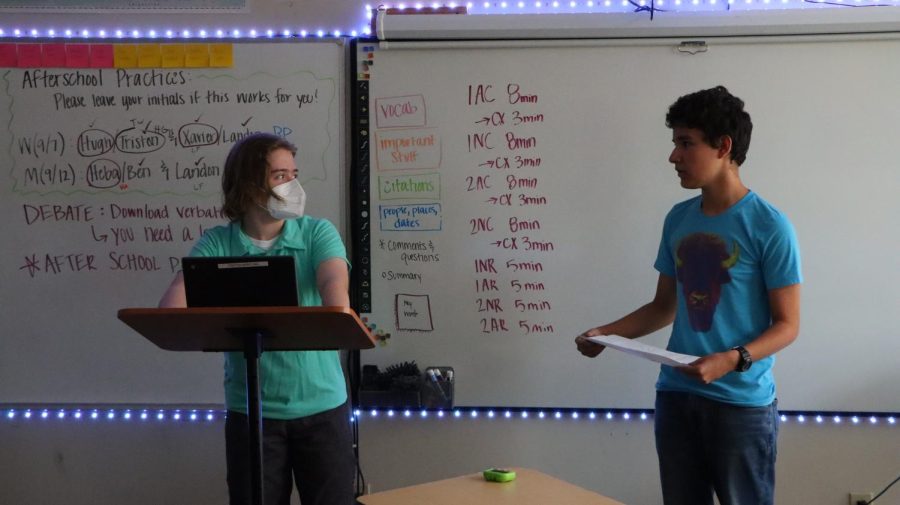 Freshmen Tristan Wentling and Xavier Carrasco-Cooper share their argument with the class. The students team up at debate tournaments to take down the competition.