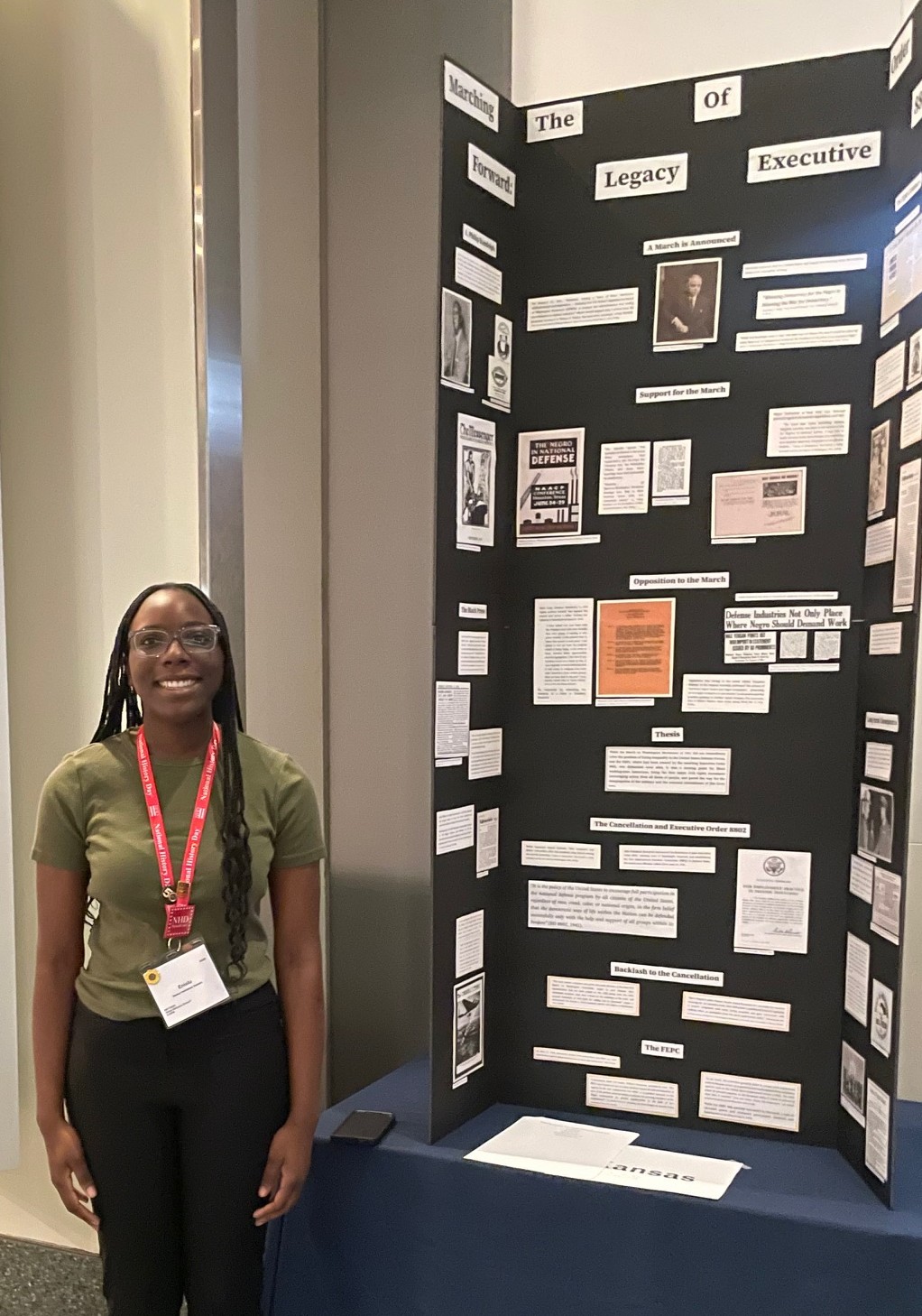 Sophomore Alice Pulsinelli points to her National History Day performance slot. Pulsinelli's presentation on Jackie Robinson was honored as one of the two best from Kansas. 