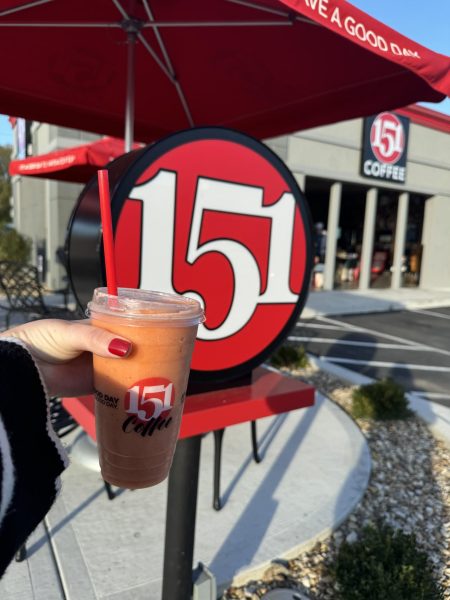 A Georgia Peach smoothie is displayed prominently in front of the red and white design of 151. Originally a Texas chain, 151 Coffee has recently opened in Lawrence.   