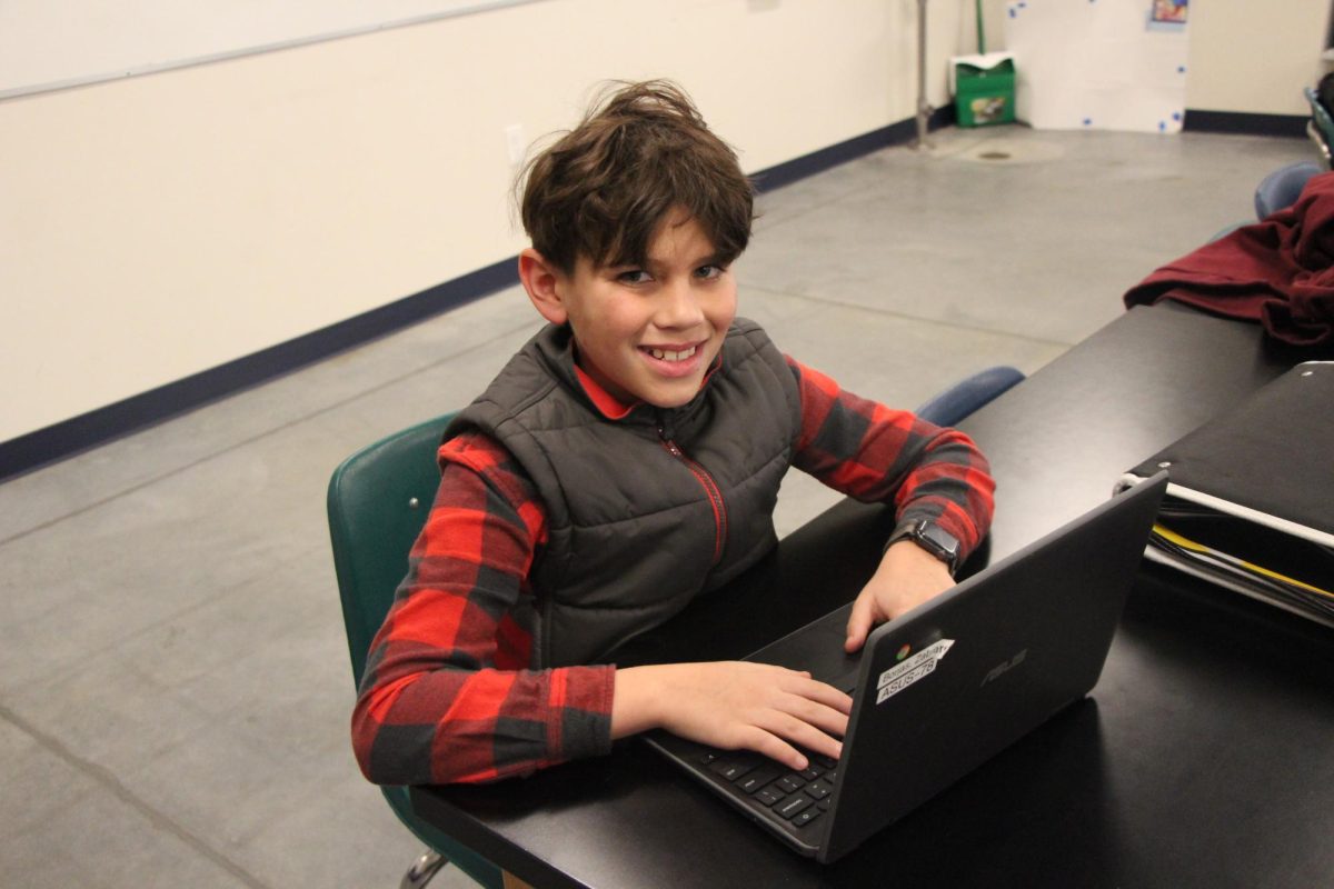 Sixth grader Zabi Borjas shows off a stunning smile while working hard. Borjas is the last in line of the Borjas clan. 