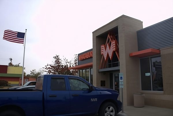 The newly arrived Whataburger welcomes eager customers on a busy day. This special location in Lawrence houses a signed Patrick Mahomes jersey.