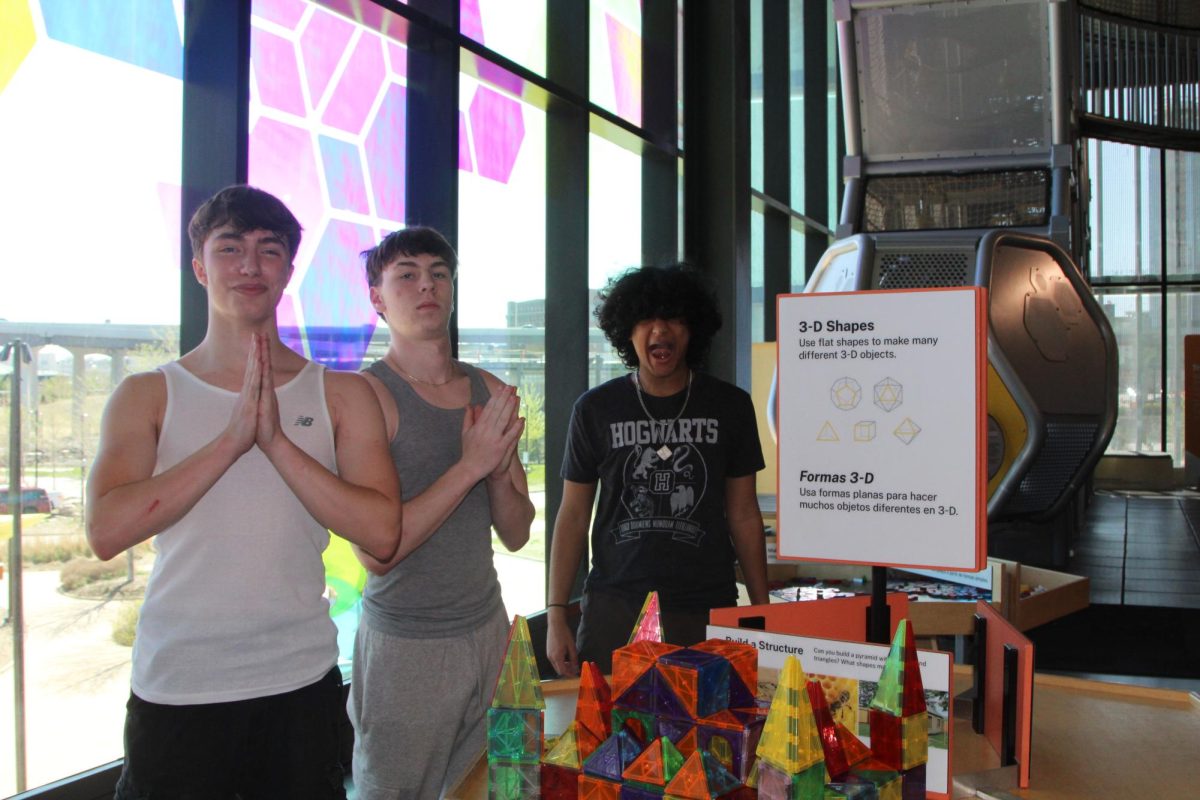 Sophomores Ben Spencer, Solomon Holman-Hebert and Izaak Arif pose whimsically at the Kewitt Luminarium in Omaha, Nebraska. On their form trip, the sophmore class also enjoyed the Henry Doorly Zoo, Spaghetti Works and free time in Old Market.